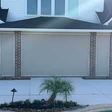Elegant-Motorized-Outdoor-Roller-Shade-w-Track-System-on-Bending-Stream-Dr-in-League-City-TX 1